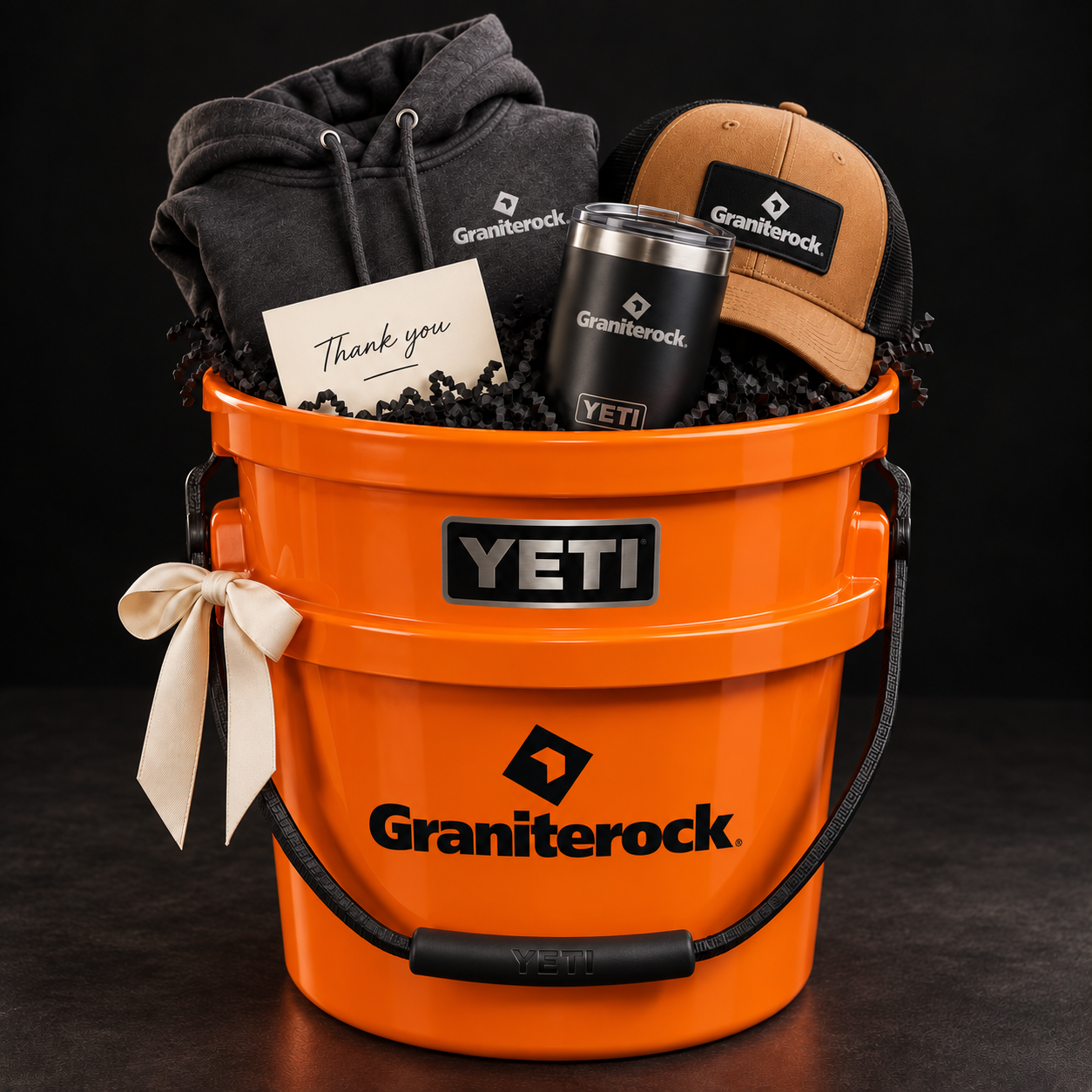 Example custom Graniterock gift bucket with branded hoodie, hat and drinkware